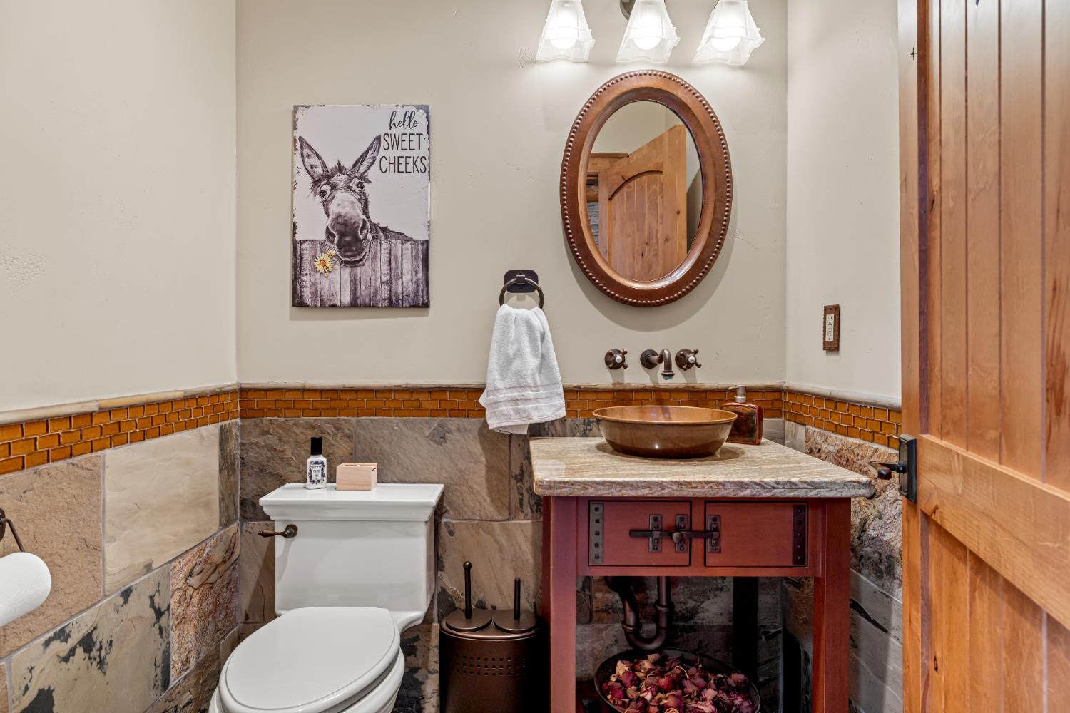 5630 Grazing Hill Road Shingle Springs, CA 95682 - Photo 77 of 86 a bathroom with a toilet a sink and a mirror
