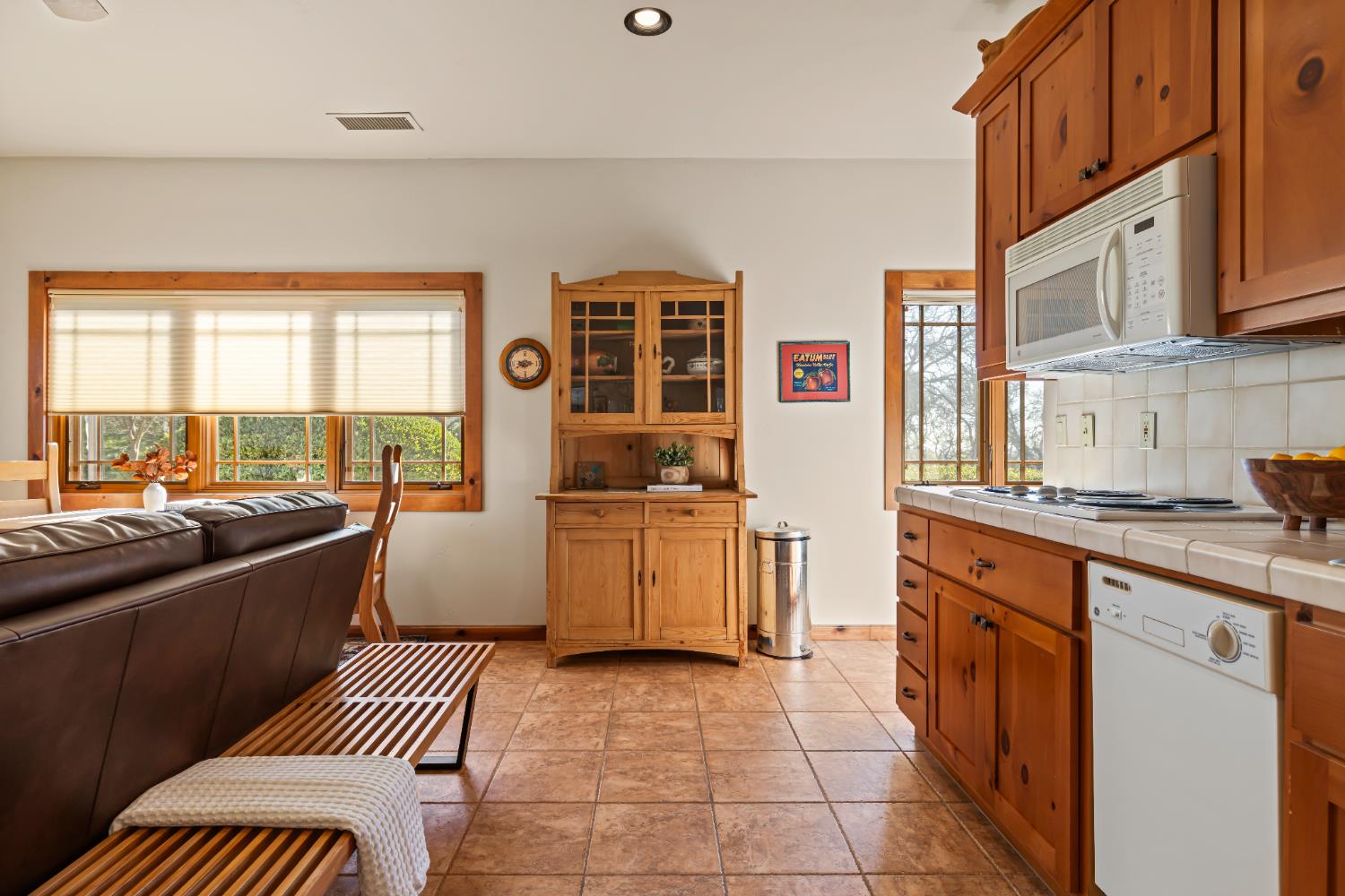 5630 Grazing Hill Road Shingle Springs, CA 95682 - Photo 81 of 86 a kitchen with stainless steel appliances granite countertop a stove a sink and a microwave