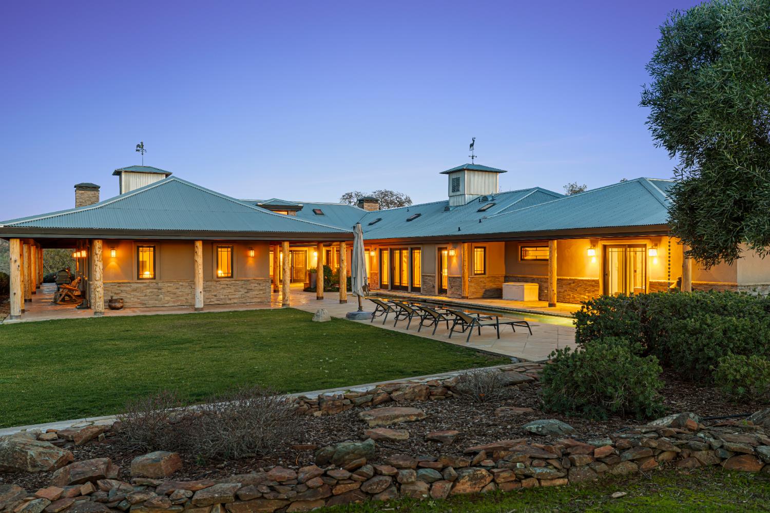 5630 Grazing Hill Road Shingle Springs, CA 95682 - Photo 9 of 86 a front view of a house with a garden