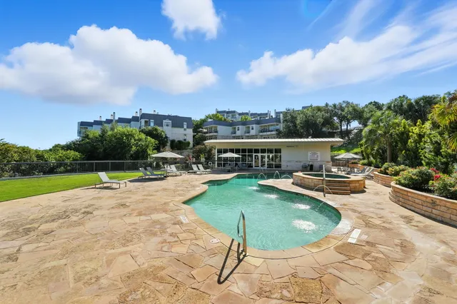 a view of swimming pool with outdoor seating
