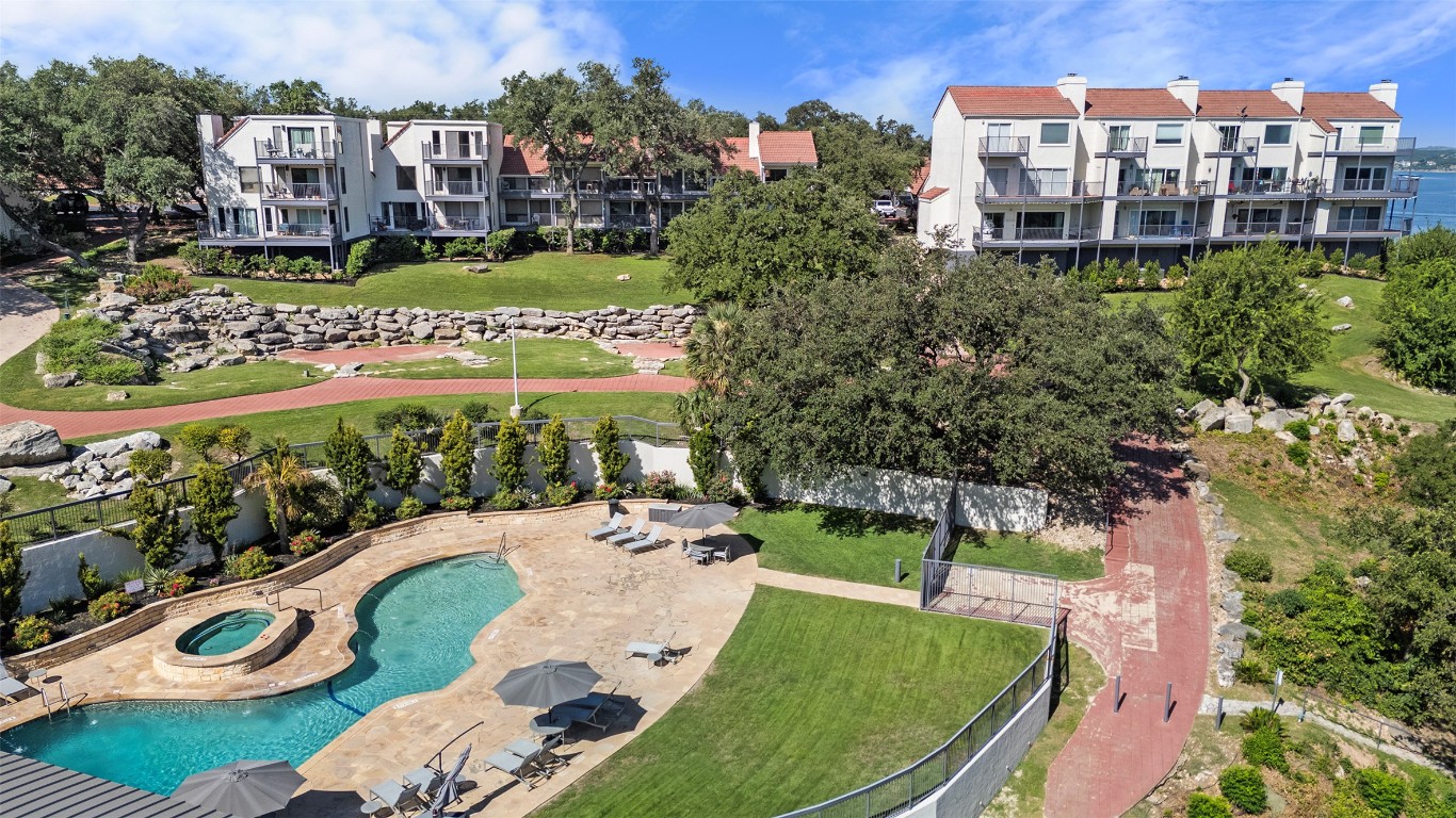 2918 Ranch Road 620 North, Unit L176 Austin, TX 78734 - Photo 28 of 35 Drone / aerial view of a pool area and apartment complex / building