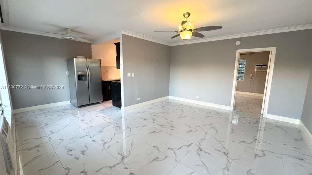 346 86th Street, Unit 2 Miami Beach, FL 33141 - Photo 4 of 13 a view of a hallway with a chandelier