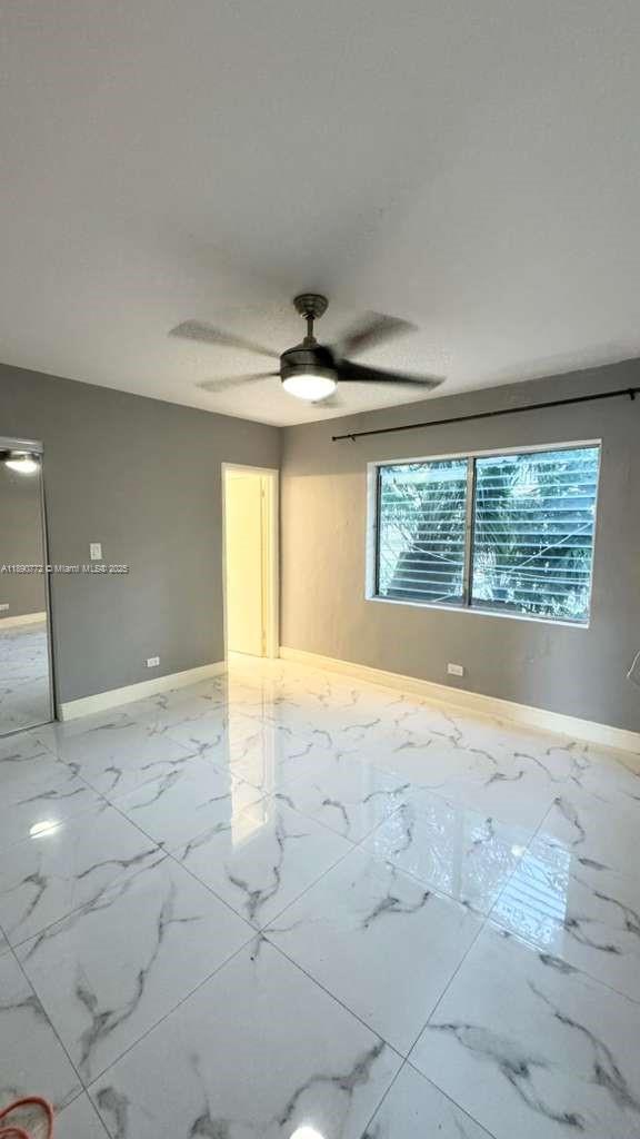 346 86th Street, Unit 2 Miami Beach, FL 33141 - Photo 7 of 13 a view of an empty room with a window