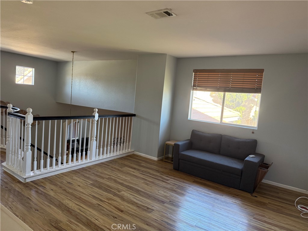 30456 Avenida Caylee Homeland, CA 92548 - Photo 18 of 27 a view of livingroom with furniture and wooden floor