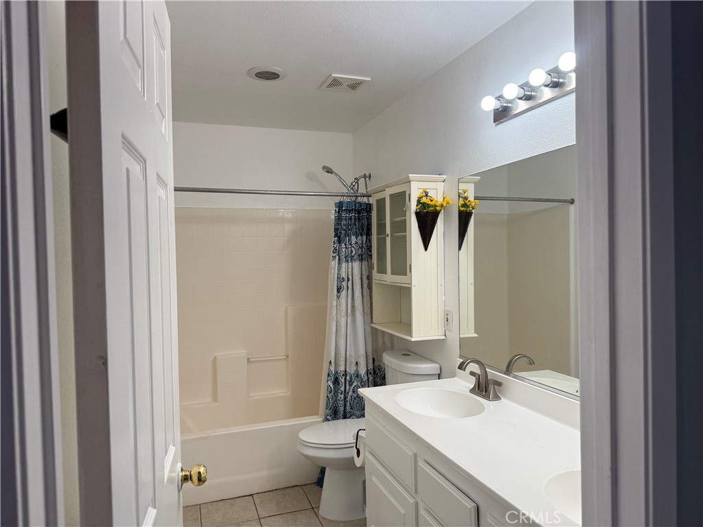 30456 Avenida Caylee Homeland, CA 92548 - Photo 21 of 27 a bathroom with a sink toilet and shower