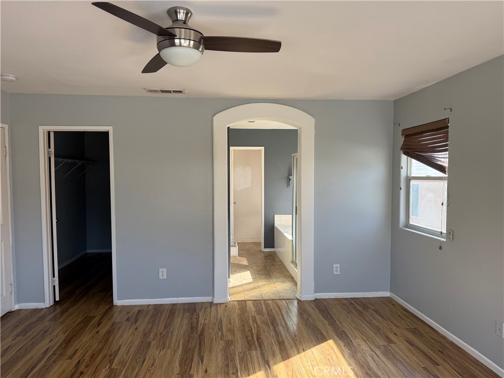 30456 Avenida Caylee Homeland, CA 92548 - Photo 23 of 27 a view of a room with wooden floor cabinet and a bathroom
