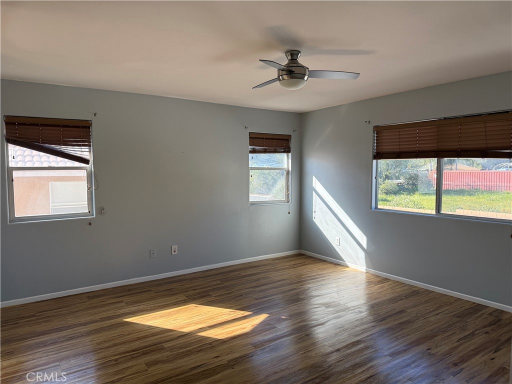 30456 Avenida Caylee Homeland, CA 92548 - Photo 24 of 27 a view of empty room with wooden floor and fan
