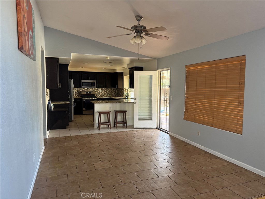 30456 Avenida Caylee Homeland, CA 92548 - Photo 10 of 27 a view of kitchen with granite countertop cabinets and refrigerator