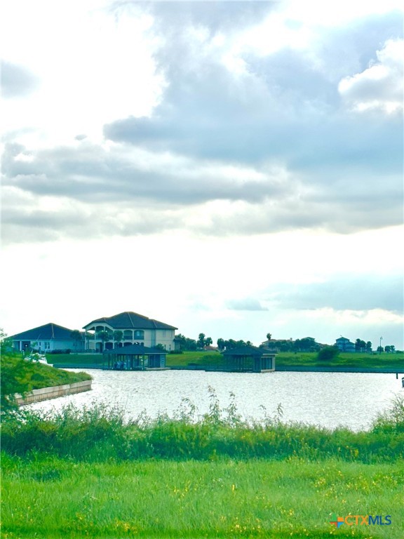 294 East Lago Loop Port O'Connor, TX 77982 - Photo 13 of 14 a view of a lake from a yard