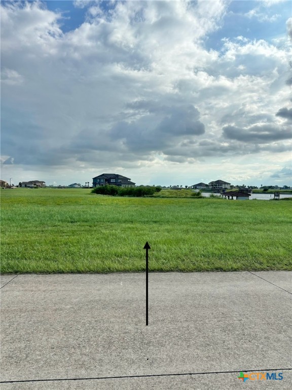 294 East Lago Loop Port O'Connor, TX 77982 - Photo 2 of 14 a view of a garden with a building