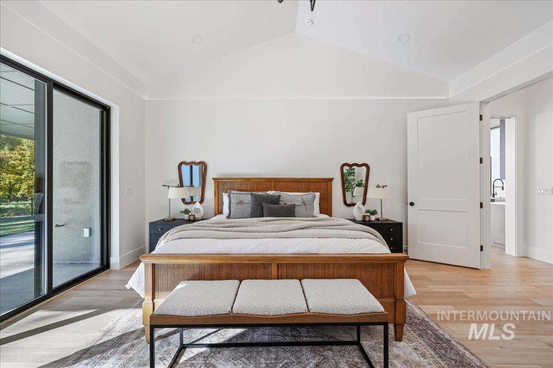 665 Watkins Street Middleton, ID 83644 - Photo 25 of 34 Bedroom with vaulted ceiling, wood finished floors, and access to outside