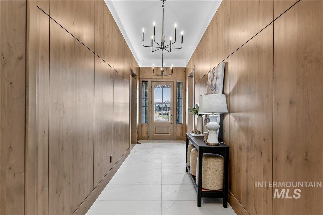 665 Watkins Street Middleton, ID 83644 - Photo 4 of 34 Doorway with a chandelier and wood walls