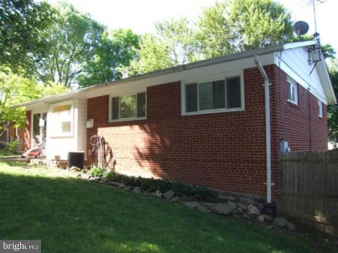 3719 Astoria Road Kensington, MD 20895 - Photo 16 of 19 a backyard of a house with seating space