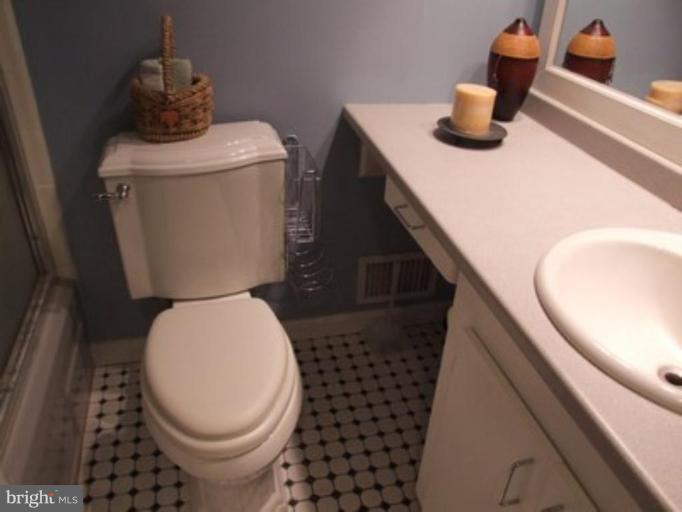 3719 Astoria Road Kensington, MD 20895 - Photo 7 of 19 a bathroom with a sink and a toilet