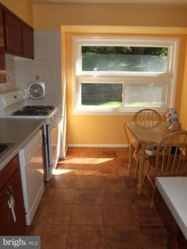 3719 Astoria Road Kensington, MD 20895 - Photo 10 of 19 a kitchen with a sink and a stove