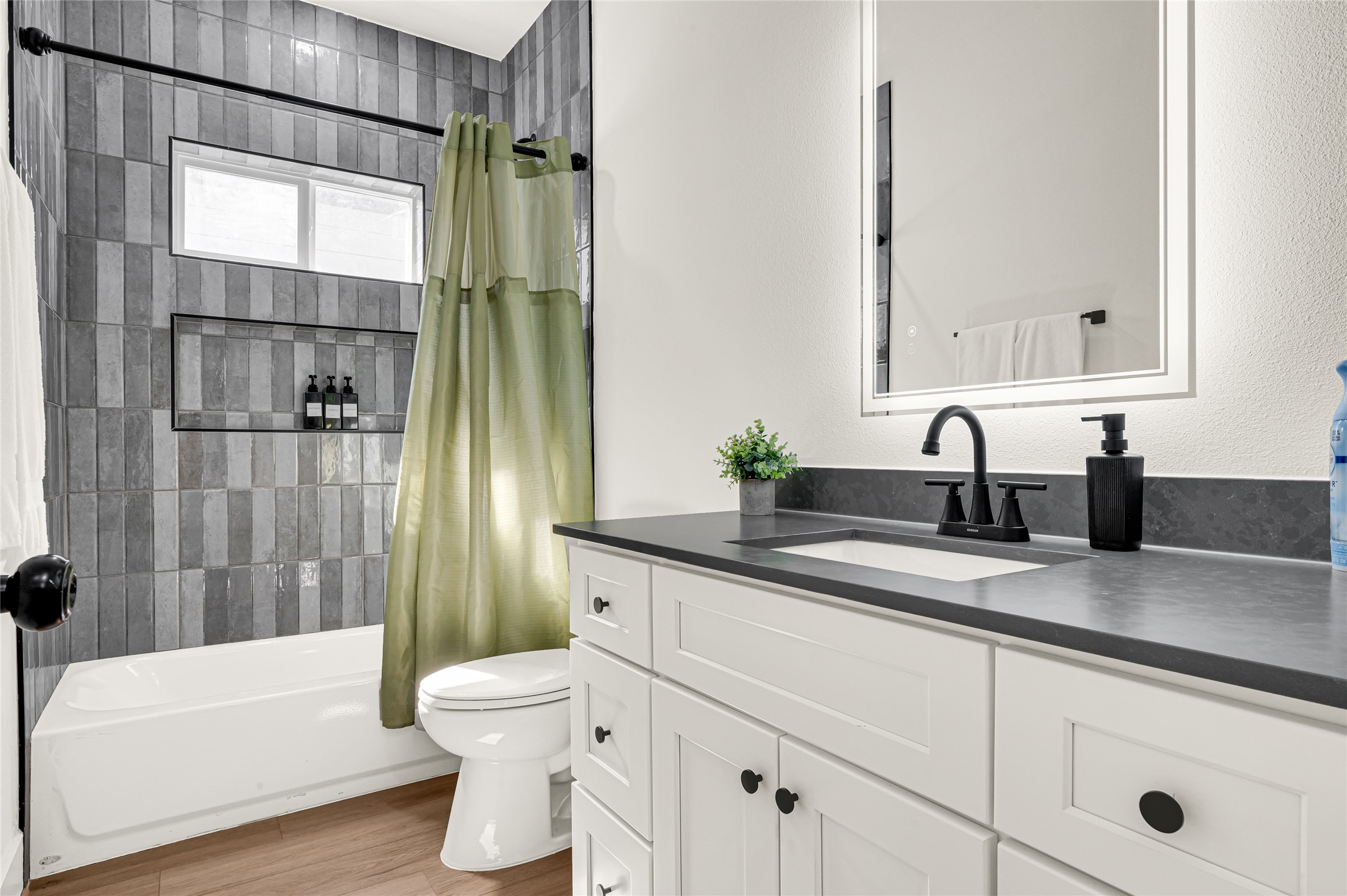 4201 Stassen Street Houston, TX 77051 - Photo 35 of 39 a bathroom with a sink a toilet and tub