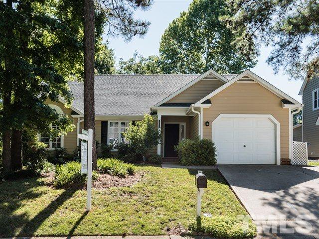 12204 Inglehurst Drive Raleigh, NC 27613 - Photo 1 of 14 a house with trees in the background