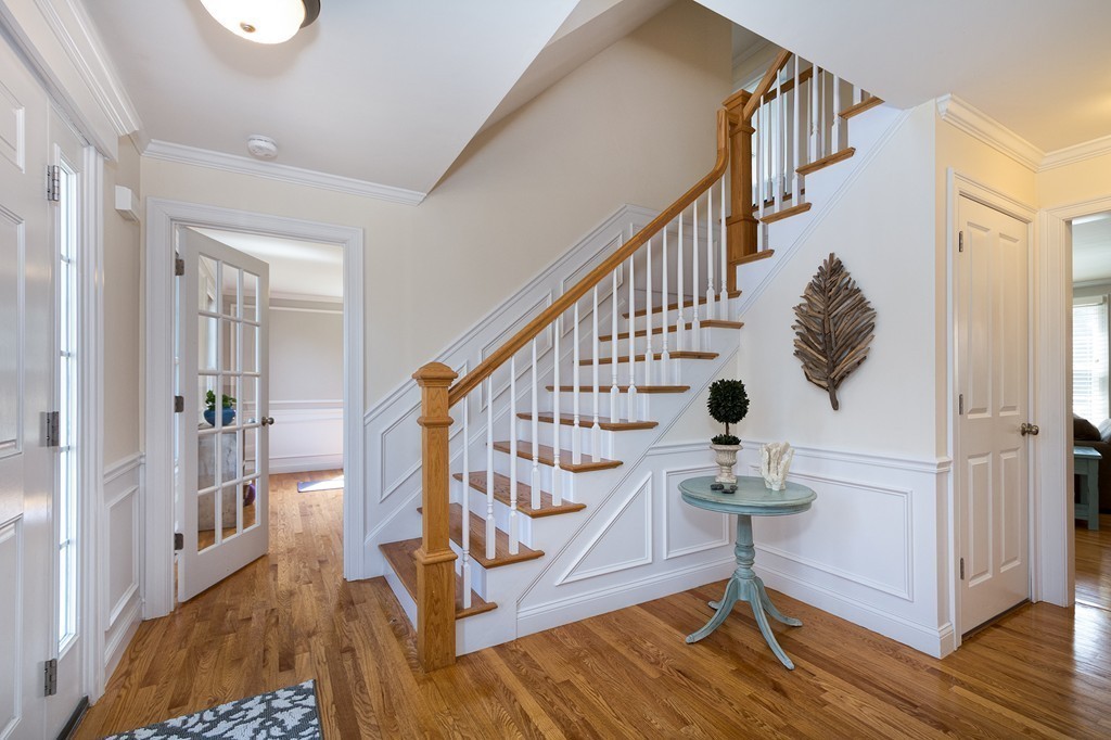 127 Tilden Road Scituate, MA 02066 - Photo 10 of 28 a view of entryway with wooden floor and stairs