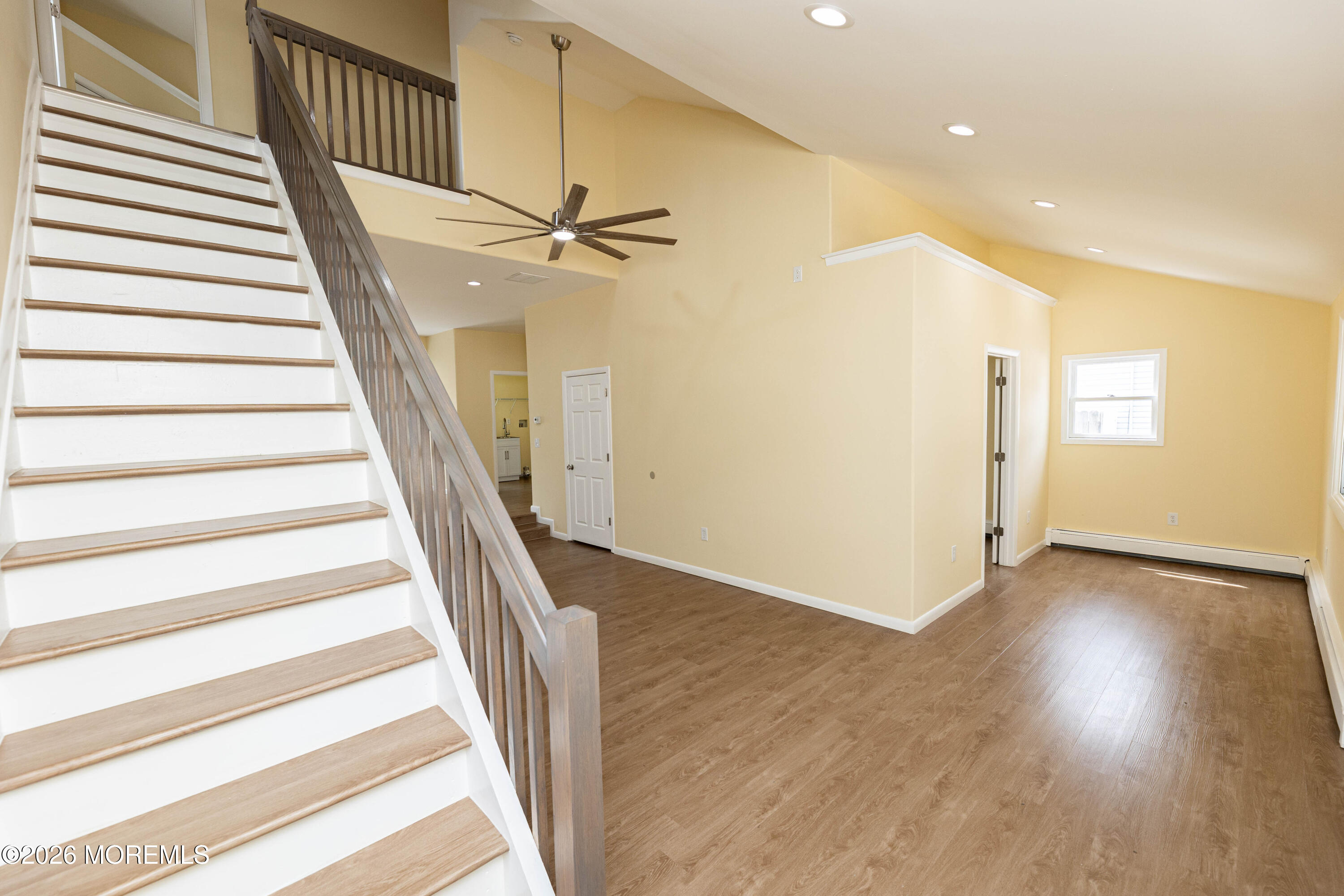 2408 Herbertsville Road Point Pleasant, NJ 08742 - Photo 28 of 82 a view of a hallway with wooden floor and staircase
