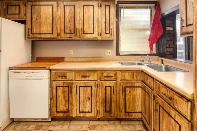 a kitchen with a sink and a window