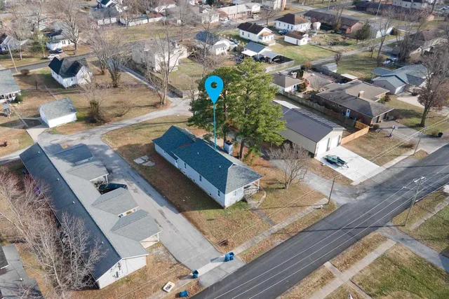 an aerial view of residential houses with outdoor space