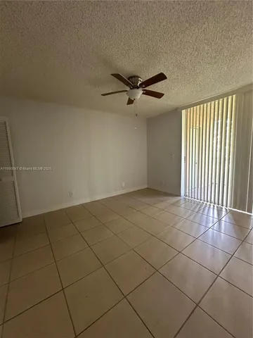 a view of an empty room and a window