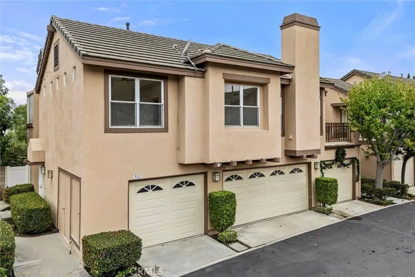 a front view of a house with parking