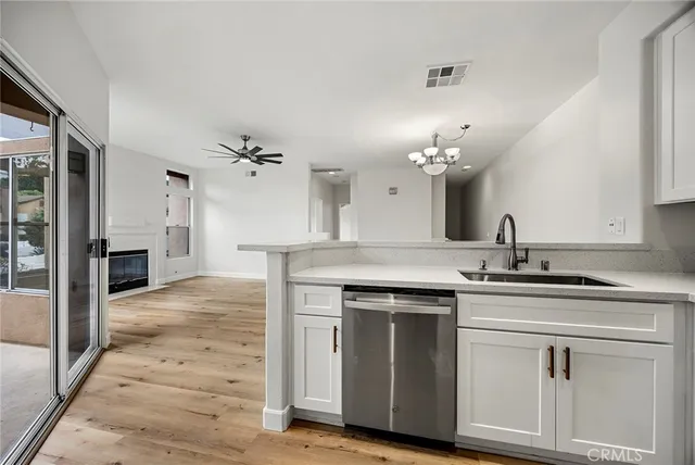 a view of a chairs and table in the balcony