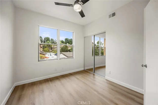 a bathroom with a glass shower door and a bathroom