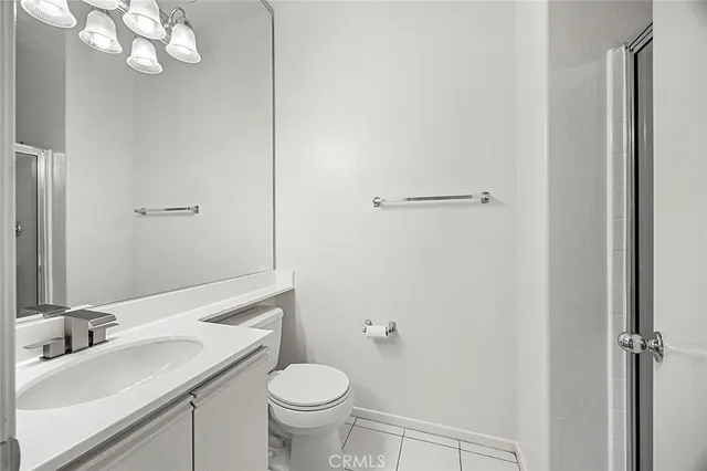 a view of a room with wooden floor and white walls