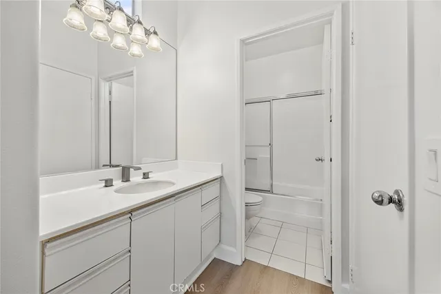 a bathroom with a sink and mirror