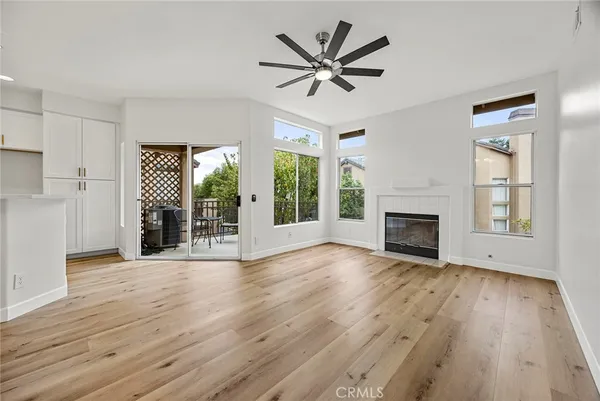 a view of kitchen with granite countertop cabinets and wooden floor