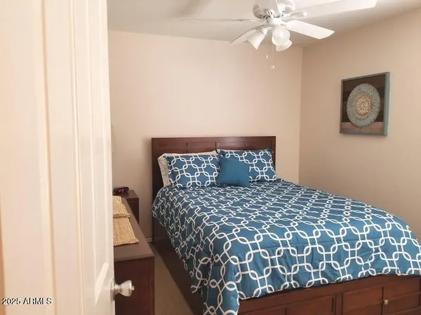 a bathroom with a sink a toilet and a window