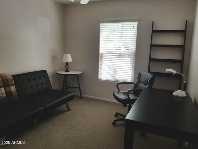 a view of a swimming pool and a yard