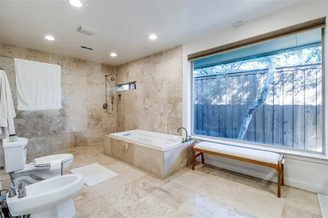 a bathroom with a sink a toilet and a bathtub