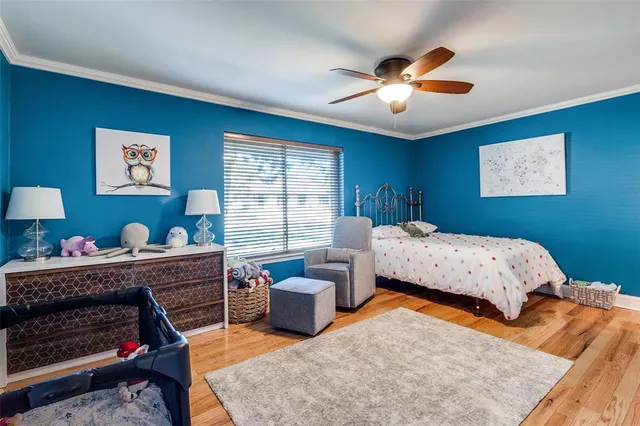 a bedroom with furniture and a chandelier