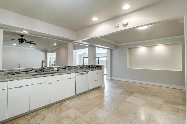 a large bathroom with a granite countertop double vanity sink a mirror and a