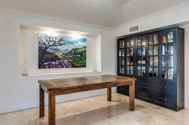 a room with furniture pool table and windows
