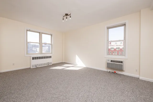 a view of a balcony with wooden floor