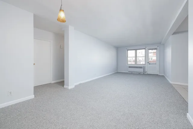 a kitchen with cabinets and a stove