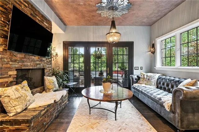 a living room with furniture fireplace and a flat screen tv
