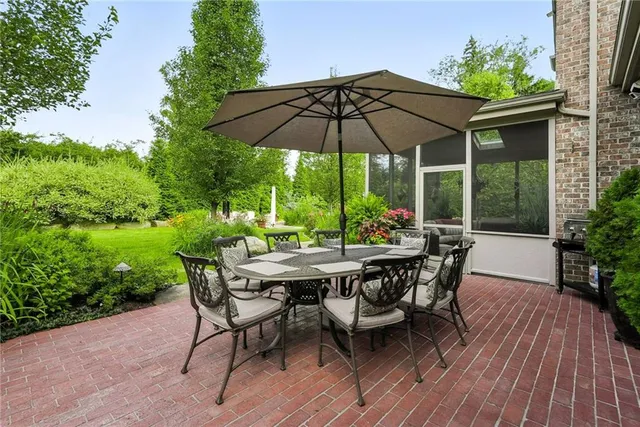 an outdoor space with furniture and umbrella