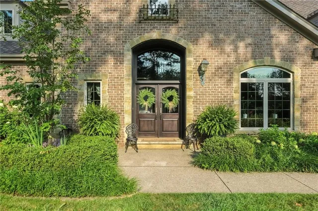 a front view of a house with garden