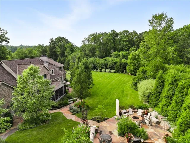 a view of a garden with a building in the background