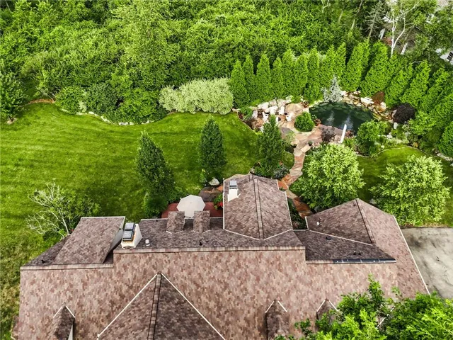 a wooden bench sitting in the middle of a garden
