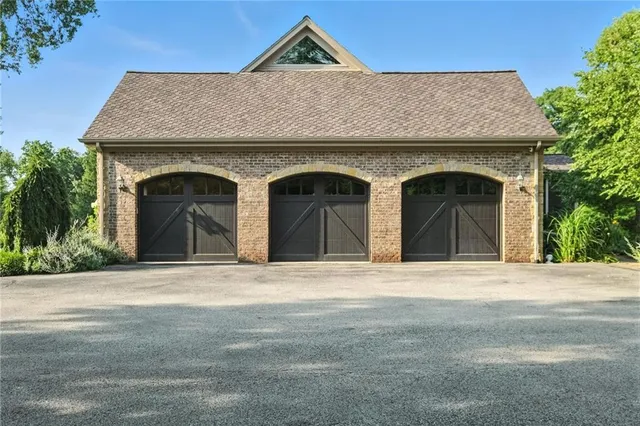 a front view of a house with garage