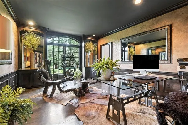 a living room with furniture and floor to ceiling windows