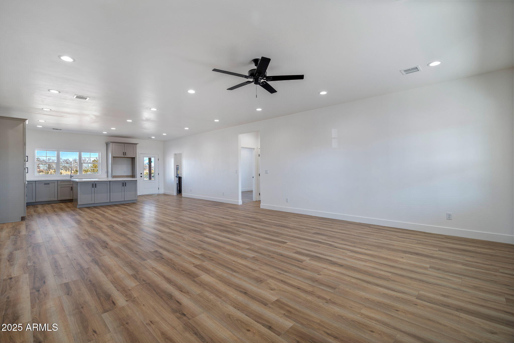 855 10th South St. Johns, AZ 85936 - Photo 11 of 41 wooden floor in an empty room with a window