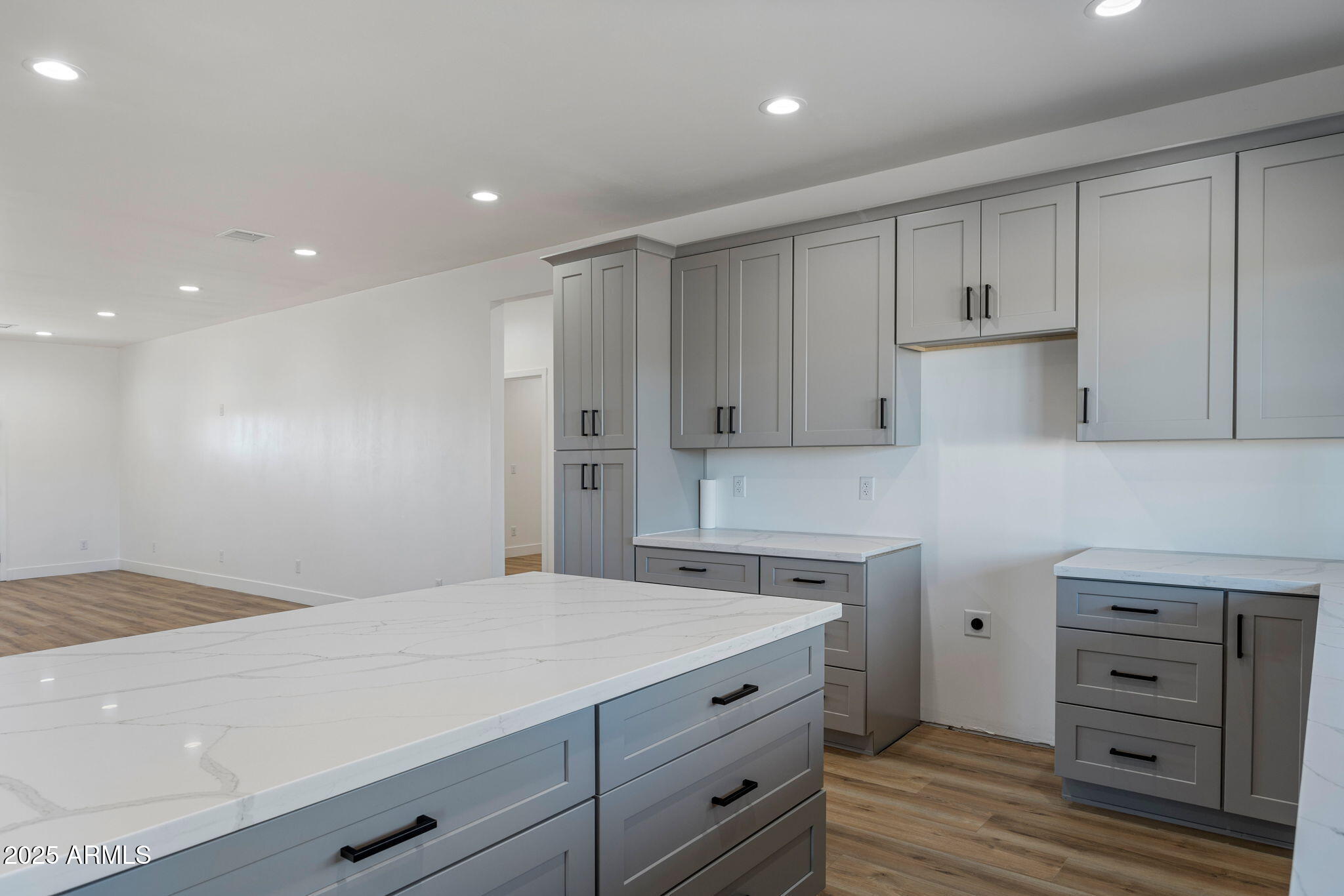 855 10th South St. Johns, AZ 85936 - Photo 17 of 41 a kitchen with a refrigerator and white cabinets