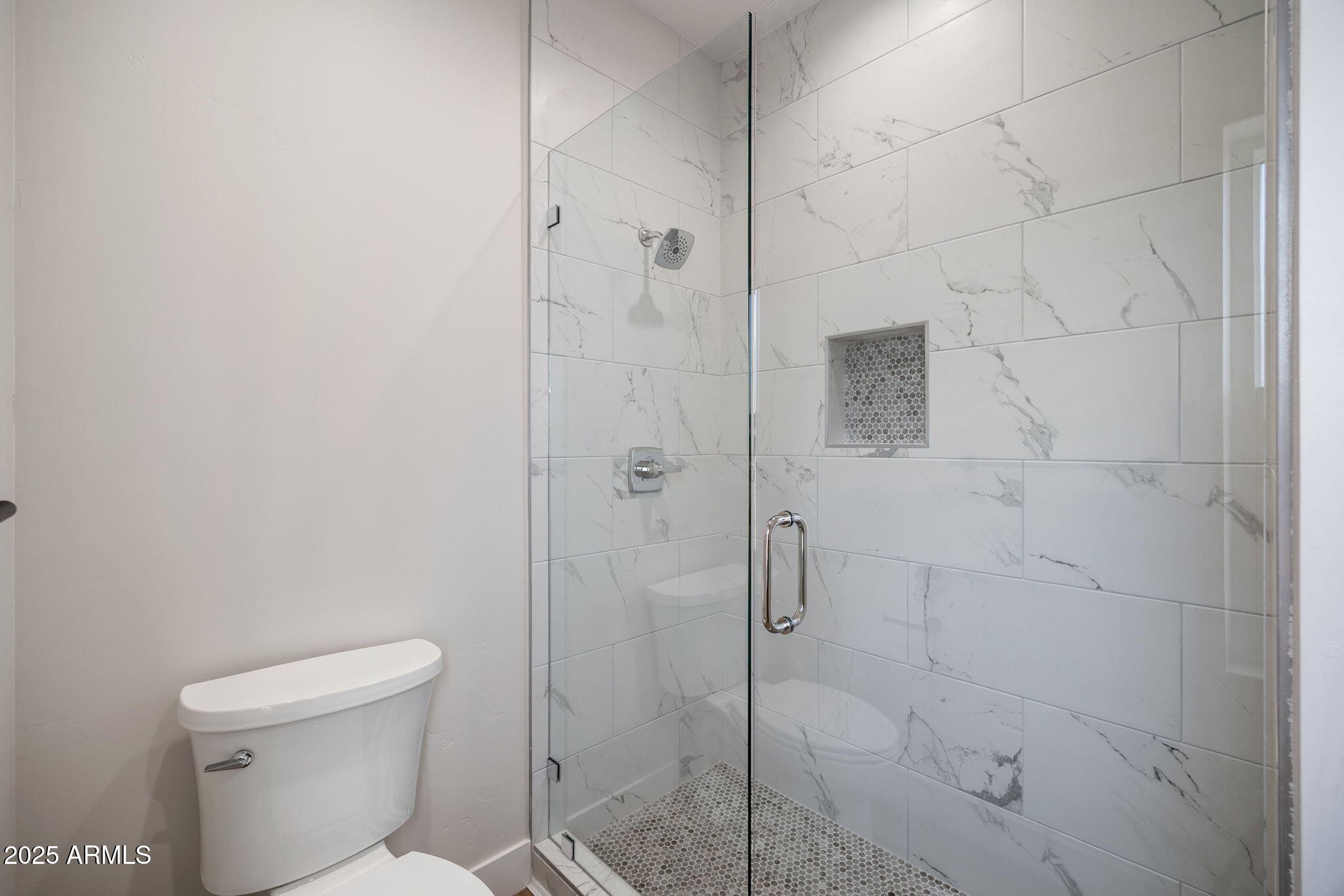 855 10th South St. Johns, AZ 85936 - Photo 28 of 41 a bathroom with a toilet and shower